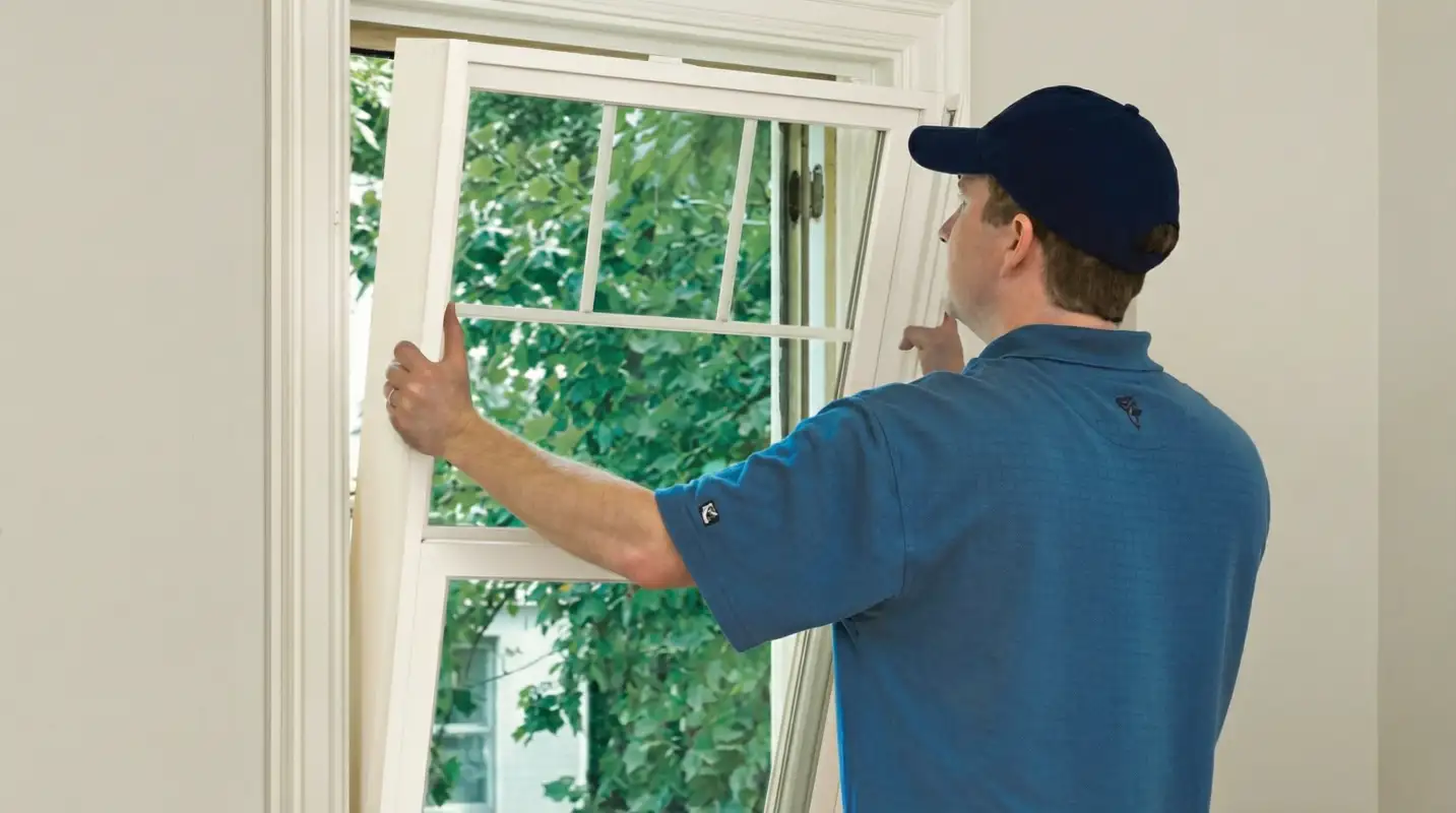 Professional contractors performing a residential window insulation and replacement service in Boca Raton, FL